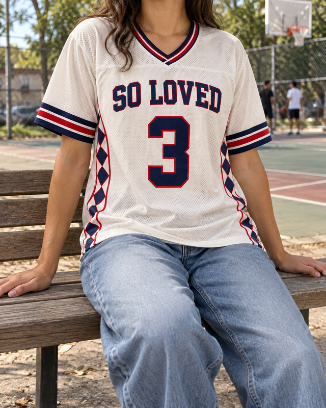 AI styling inspiration: So Loved jersey worn beside a neighborhood basketball court